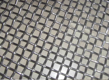A piece of plain weave woven vibrating screen mesh on the ground.