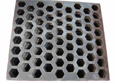 Several pieces hexagonal perforated vibrating screen meshes on the white background.