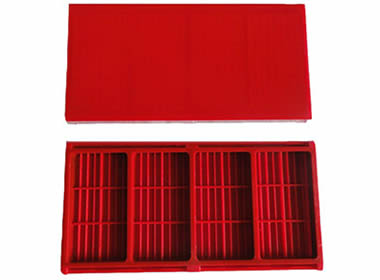 Two pieces of red polyurethane dewatering screens with one positive and the other negative.